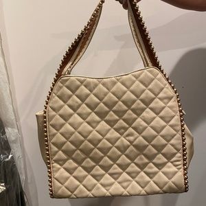 Cute tan bag with beads on the straps